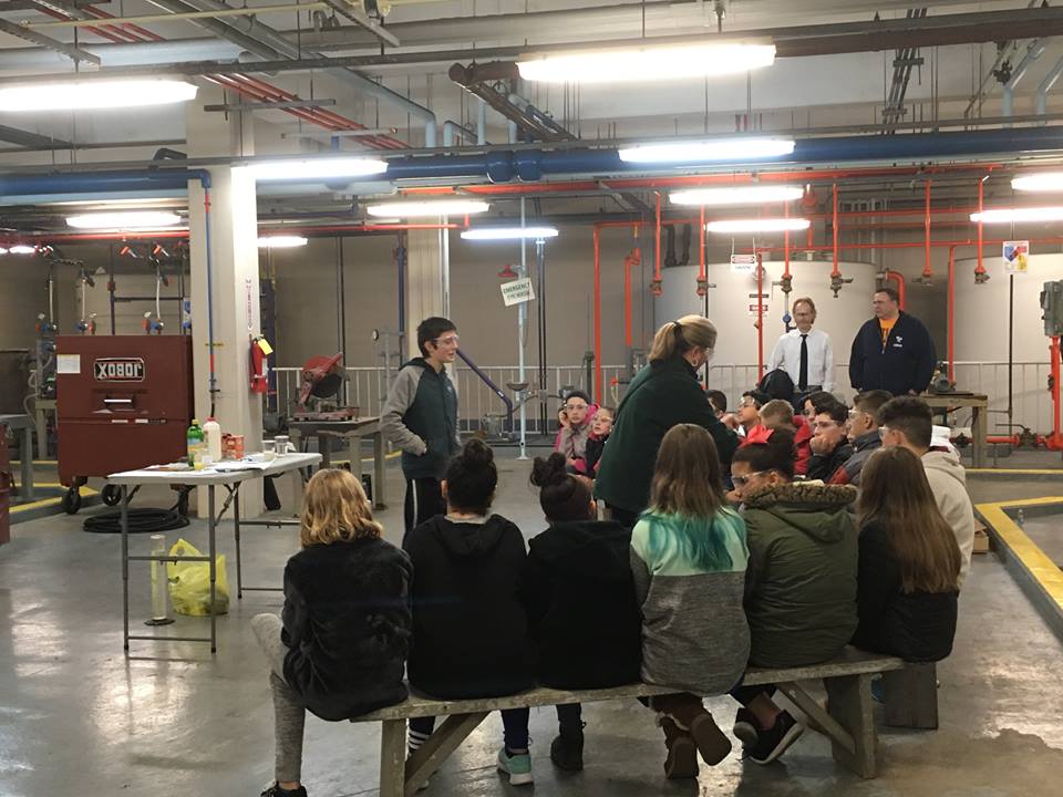 Students participating and listening during Water Treatment Plant tour